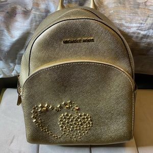 Michael Kors gold backpack and matching wallet